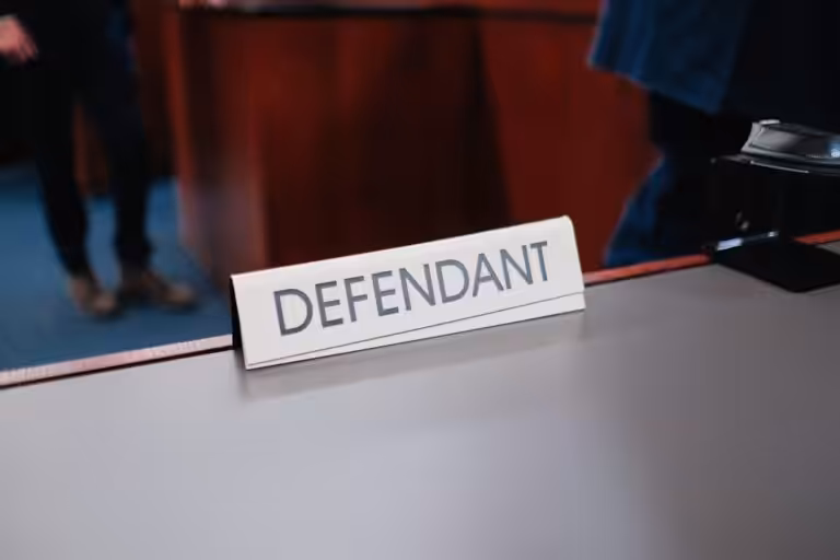 a desk with a sign on it that says defend