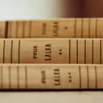 a close up of three books on a table